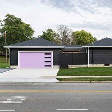 This garage rebuild was all about rethinking a dated, small garage and transforming it into a bolder, two-car garage and breezeway.